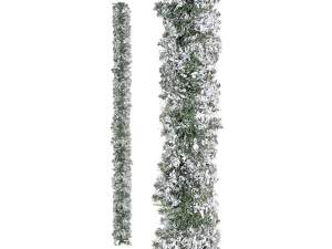 Artificial snow covered fir garlands