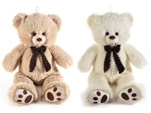 Teddy bear with velvety fabric bow