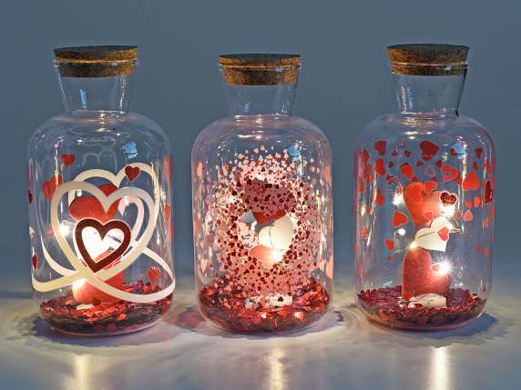 Tarro de cristal decorado con lentejuelas de corazones y luc