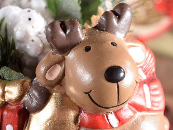 Tarro de cerámica con personaje navideño sobre estrella dora