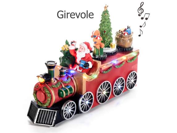Moș Crăciun într-un tren cu mișcare, lumini multicolore și m