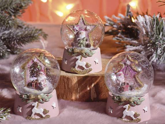 Snow globe with resin base Christmas decorations on display