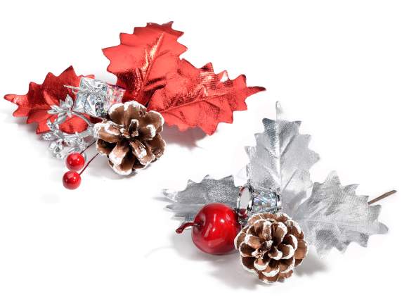 Sprig with snow-covered pine cone and decorations