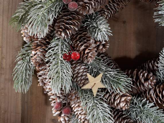 Garland with snowy pine and pine cones, red berries and star