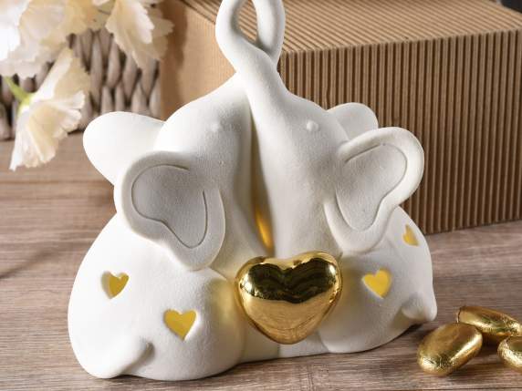 Par de elefantes de porcelana con luz led y corazón dorado