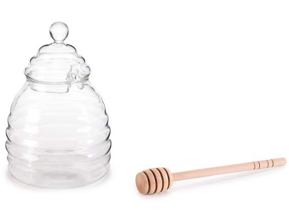 Glass honey jar with wooden honey scoop