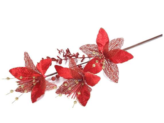 Branche de poinsettia rouge avec des baies scintillantes