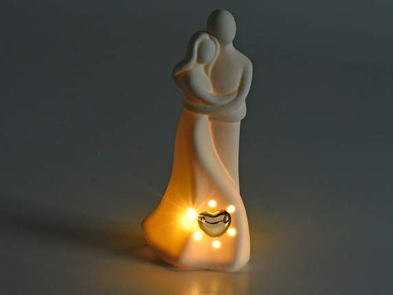 Liebespaar aus Porzellan mit goldenem Herz und LED-Lichtern