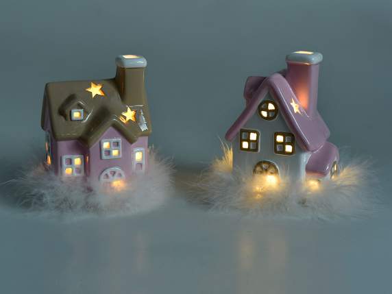 Glänzendes Keramikhaus mit LED-Leuchten auf weichen Federn