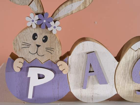Pâques écrit en bois coloré avec oeufs et lapins
