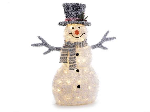 Muñeco de nieve en tejido cubierto de nieve con luces led de