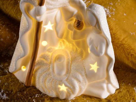 Belén de cerámica blanca con detalles dorados, purpurina y l