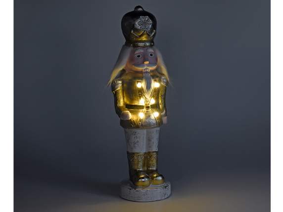 Personaje Cascanueces en resina blanca-dorada con luces LED