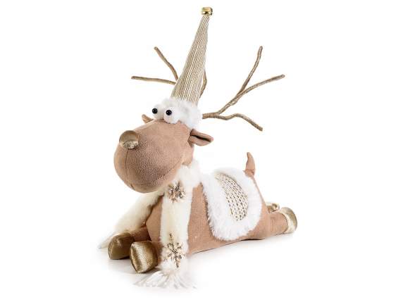 Reindeer lying in fabric with golden details and bell