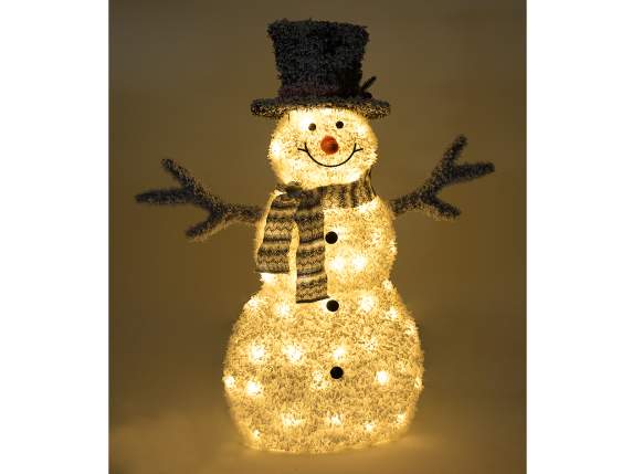 Schneemann aus schneebedecktem Stoff mit warmweißen LED-Lich