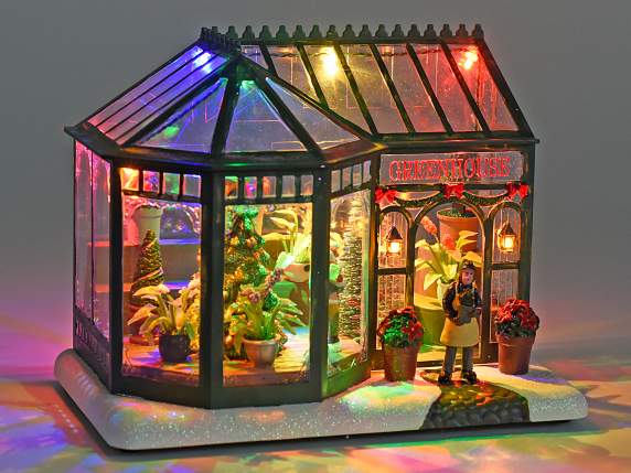 Paisaje de invernadero nevado navideño en resina con luces.