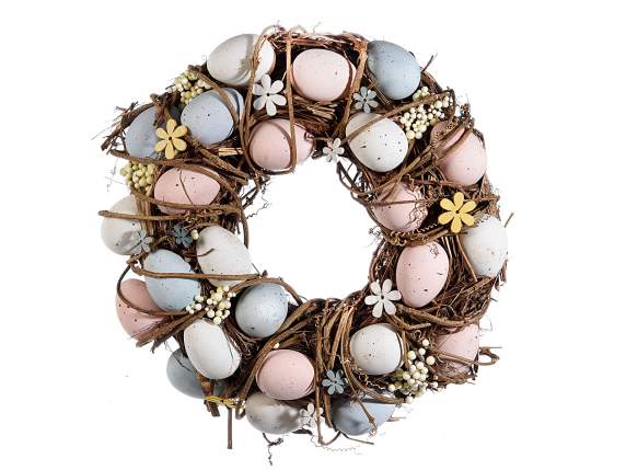 Wreath with colored eggs and wooden flowers