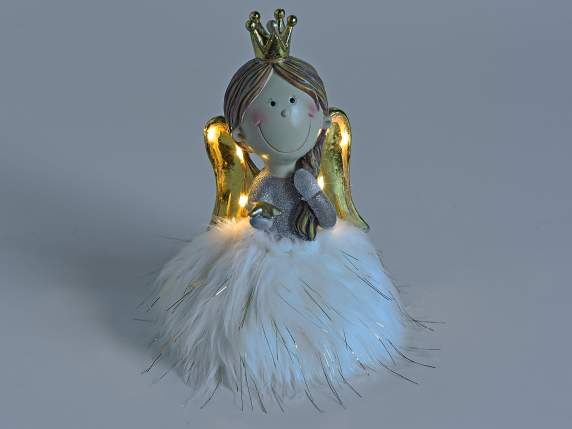 Resin angel with eco-fur skirt and golden wings with LED lig