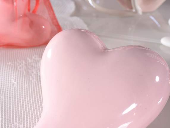 Set of 2 glossy colored ceramic hearts to be placed on