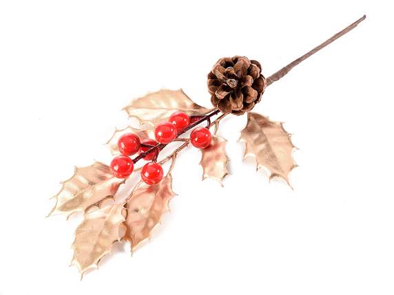 Sprig of holly with golden leaves, red berries and pine cone