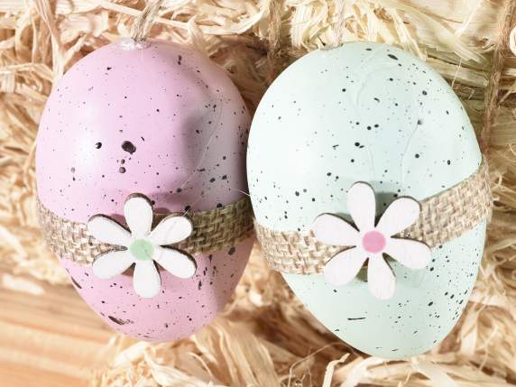 I display 6 colored plastic eggs with wooden flowers to hang