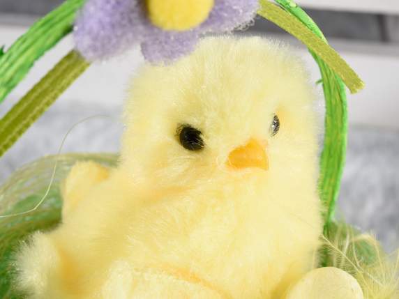 Easter chick with eggs in natural fiber basket