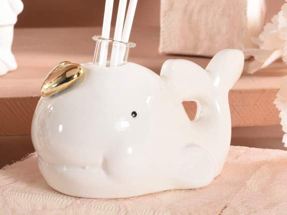 Porcelain whale with golden heart and perfume stick