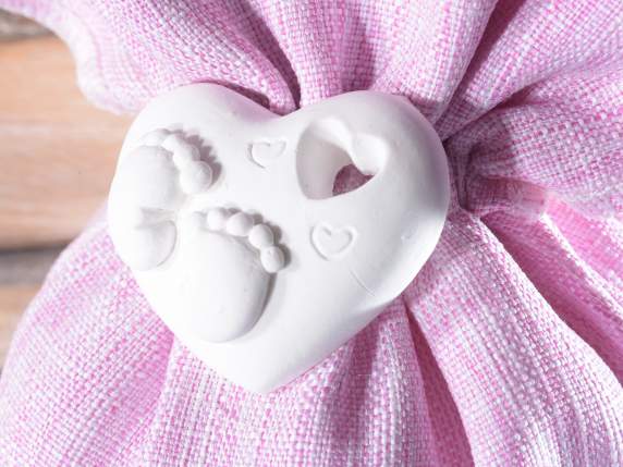Cotton bag with baby feet on plaster heart and tie rod