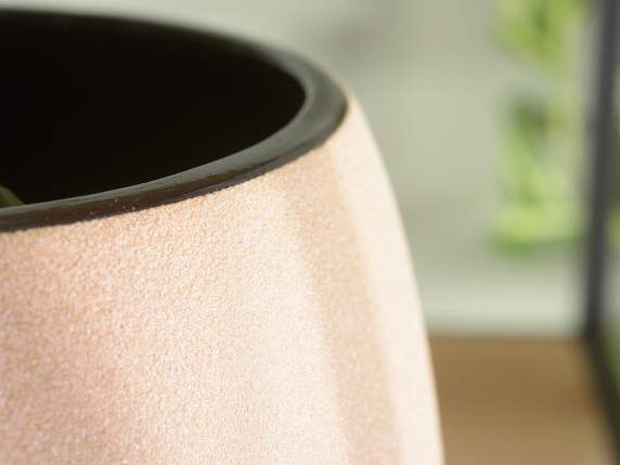 Colored raw porcelain vase with black interior