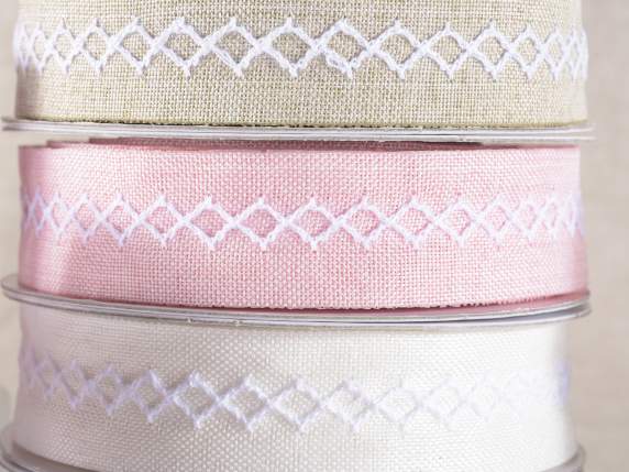 Colored fabric ribbon with embroidered meander