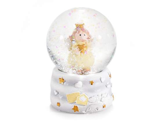 Glass snowball with little angel on a resin base on display