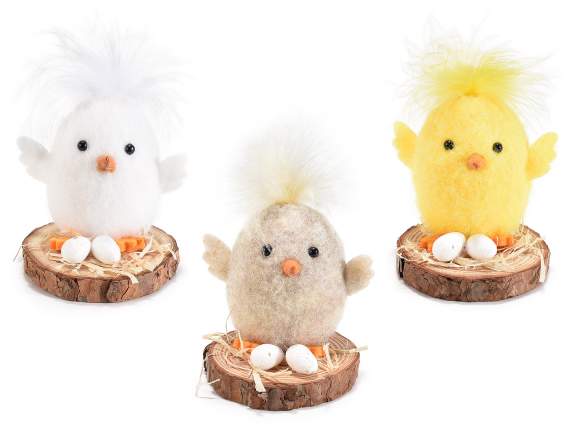 Cloth chick with eggs on a wooden base to place