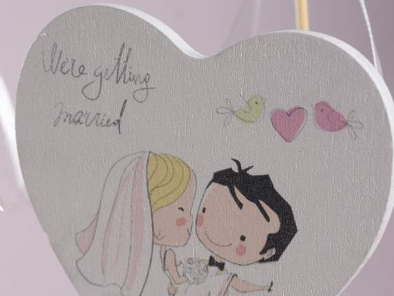 Wooden heart on stick and bow Spouses