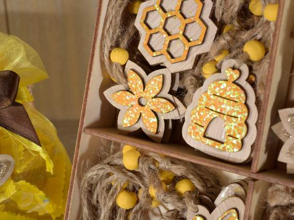 Display 72 wooden glittered bee-honey decorations to hang
