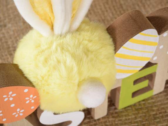 Easter writing in colored wood with eggs and rabbit pompoms