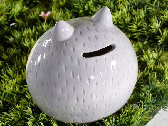 Animal-shaped piggy bank in colored ceramic