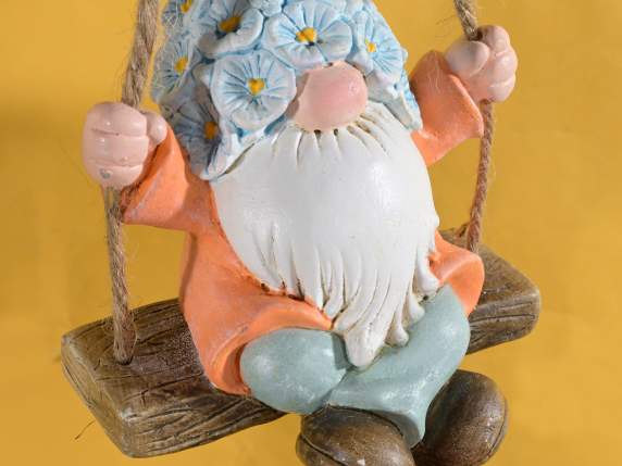 Decorative resin gnome on swing to hang