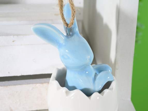 Colorful porcelain bunny in a hanging egg