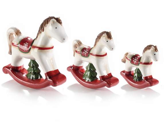 Set of 3 ceramic rocking horses with tree to support