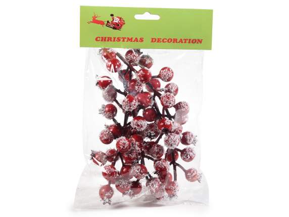 Sprig of artificial red snow capped berries