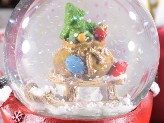 Bola de nieve con personaje navideño sobre base de resina