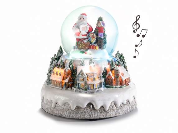 Paysage de Noël avec boule de neige, lumières multicolores e
