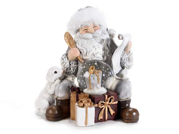 Père Noël avec coffrets cadeaux en résine et boule de neige