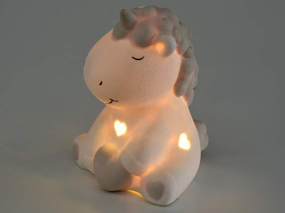 Licorne assise en porcelaine mate avec lumière LED