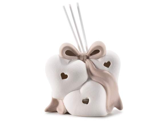 Coeurs en porcelaine avec noeud et lumières avec bâton de pa