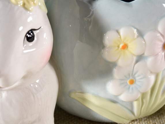 Egg-shaped ceramic vase with bunny and flowers in relief