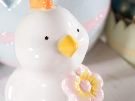 Ceramic chick with colored flower to place