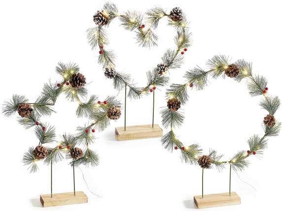 Metal Christmas decoration on wooden base with pine cones an