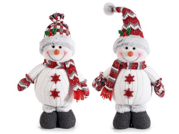 Snowman with knitted scarf, hat and mittens