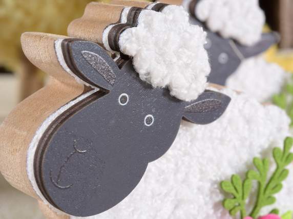 Wooden sheep with soft covering and colored flower